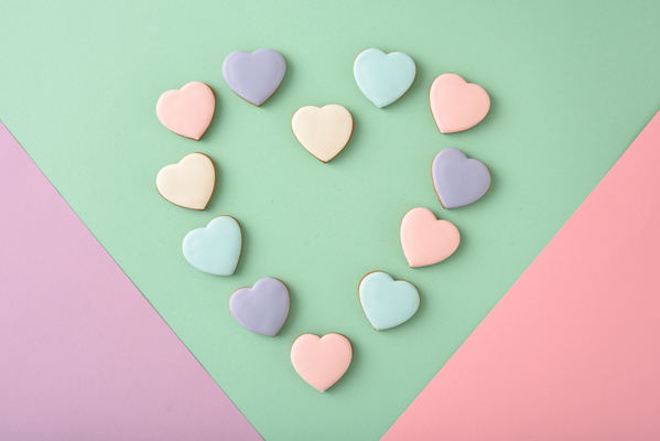 Heart-Shaped Cookies Lie on Multicolored Background